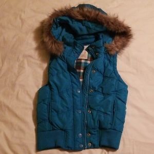 Puffy vest with detachable fur trimmed hood